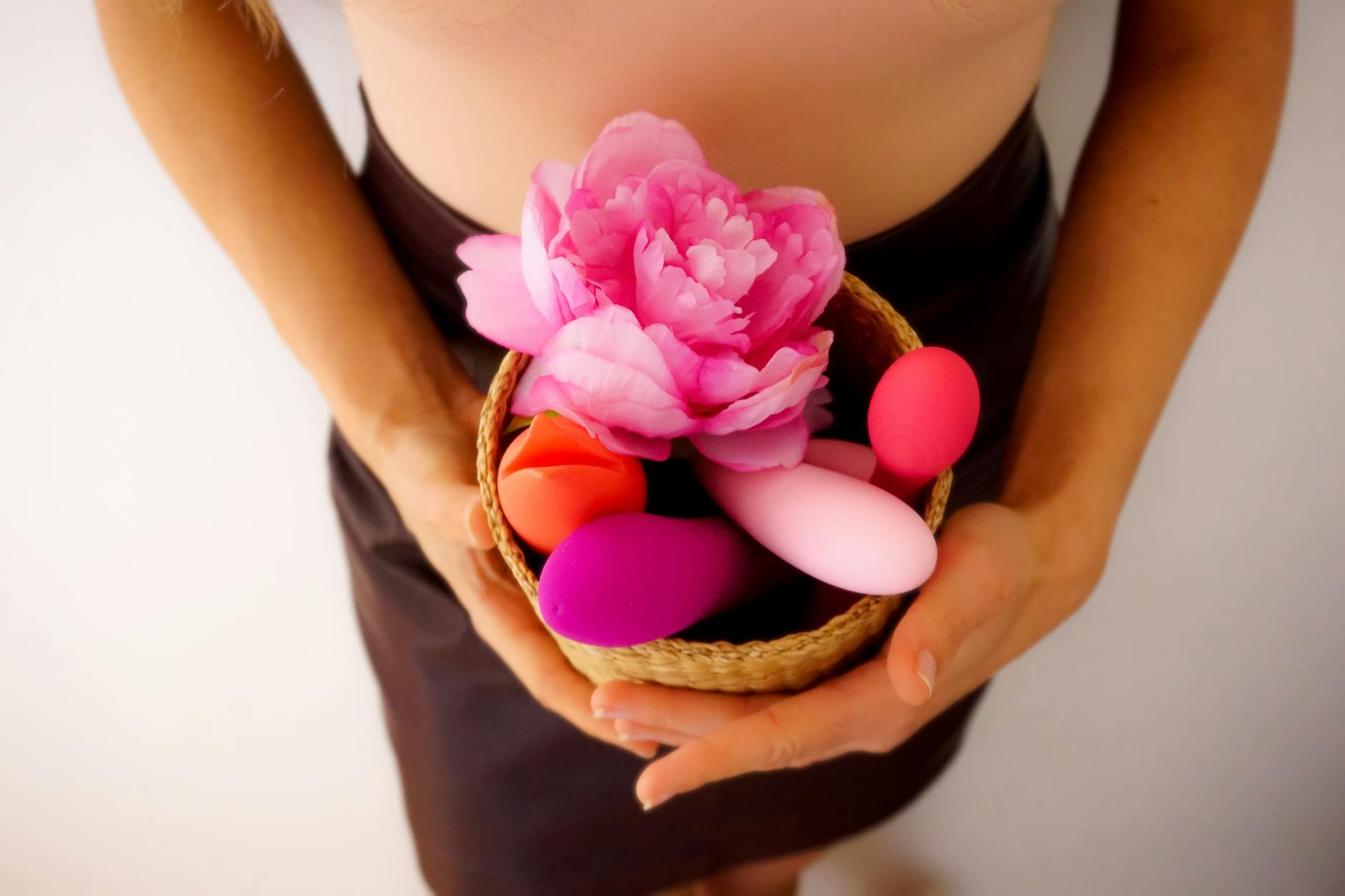 Colorful vibrators and intimate wellness items in a natural setting